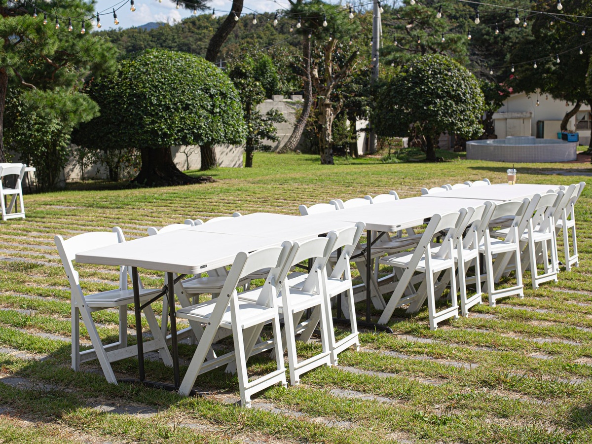 Rectangular tables with white resin chairs