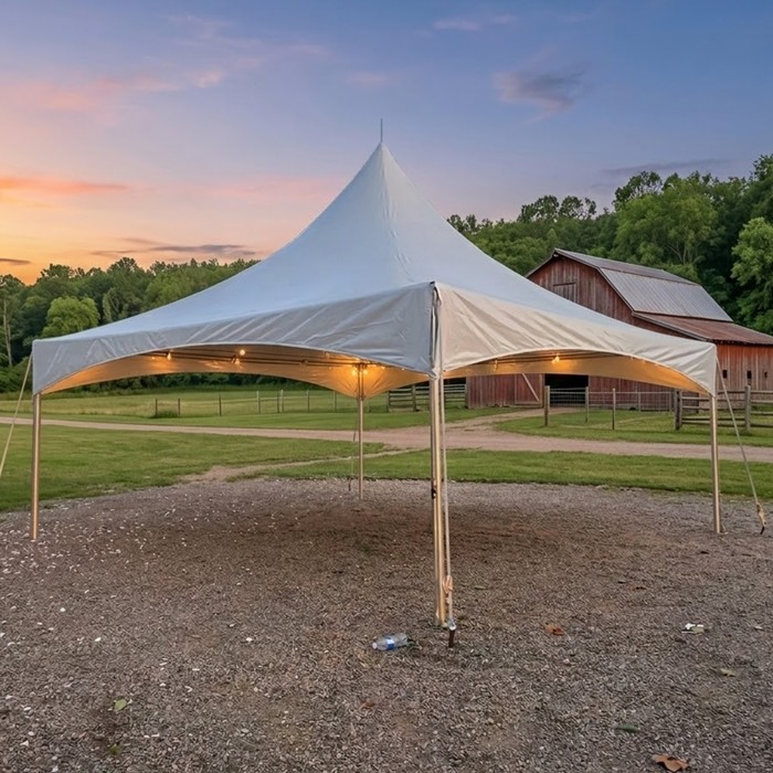 High Peak tent with warm lights at sunset